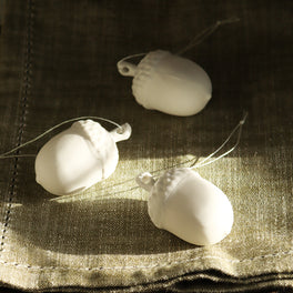 Three White Porcelain Acorn Baubles